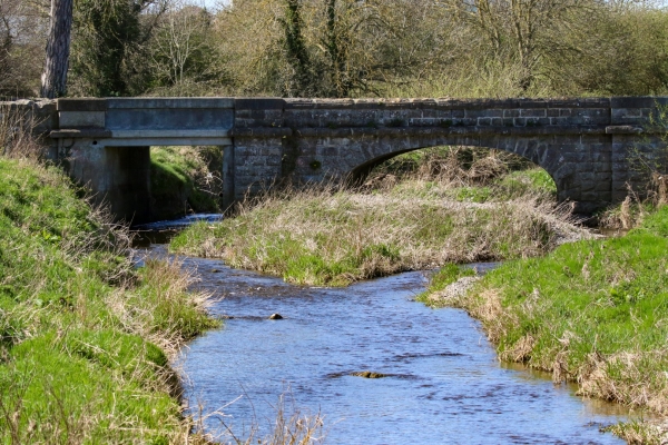 An Old stone bridge spans the Broadmeadows River in Swords, County Dublin
