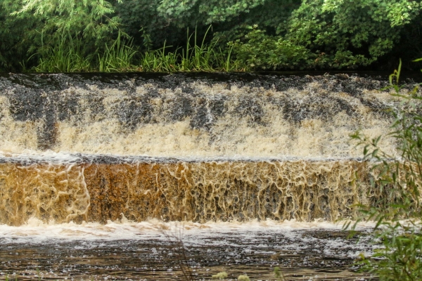 A weir on the Dodder River in full Flow - Dodder River, Dublin