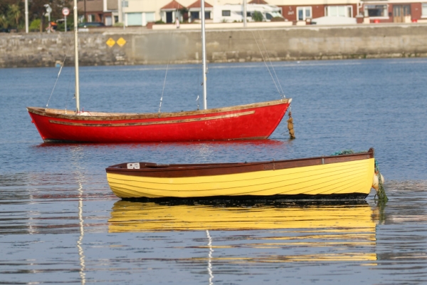A Pair of brightly coloured boats at Bull Island, Dublin